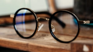 Eyeglasses sitting on a wooden table