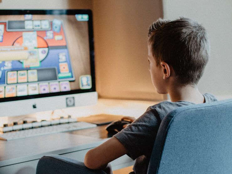 A child playing a game on a computer.