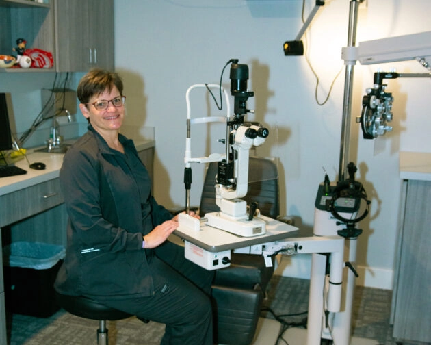 A doctor with eye examination equipment.