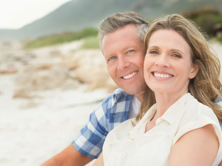 Smiling couple on the beach