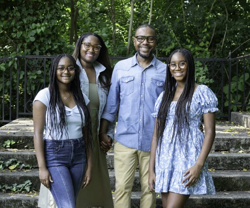 A group of people smiling and posing for a picture.