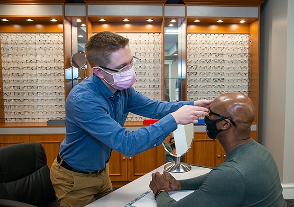 Staff member helping a patient