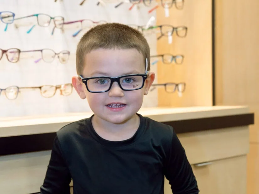 A young boy wearing glasses.