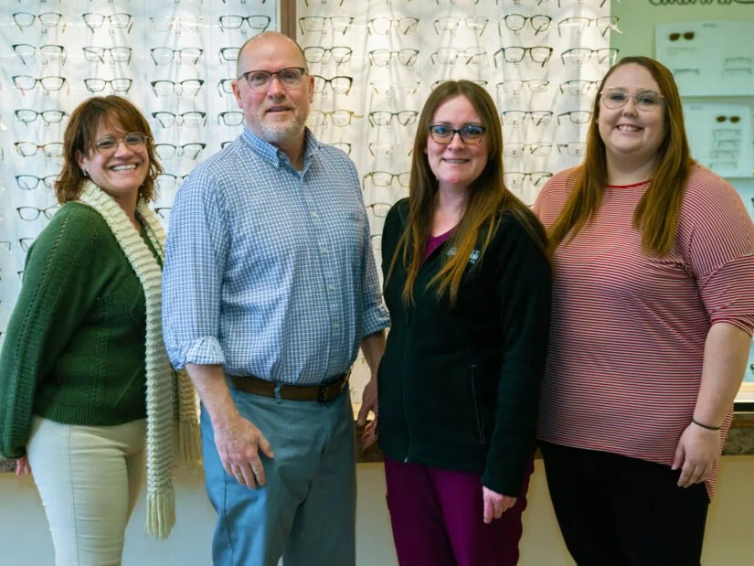 Four people wearing eyeglasses.