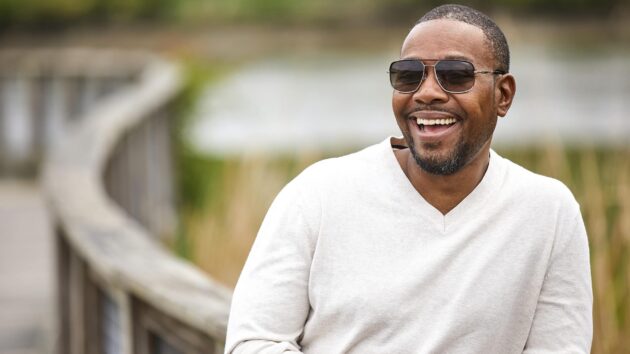 Smiling man wearing sunglasses