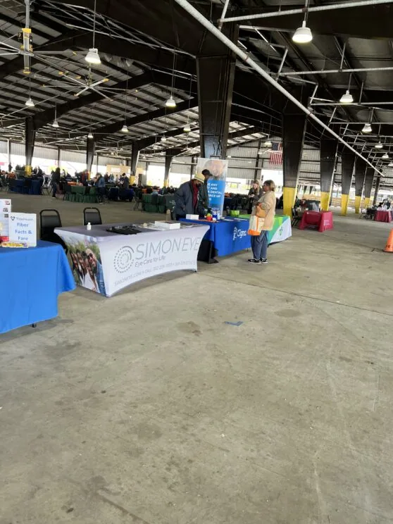 A group of tables one labeled Simon Eye.