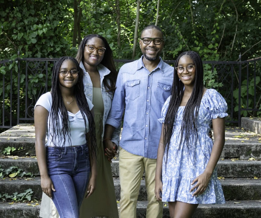 A group of people smiling and posing for a picture.